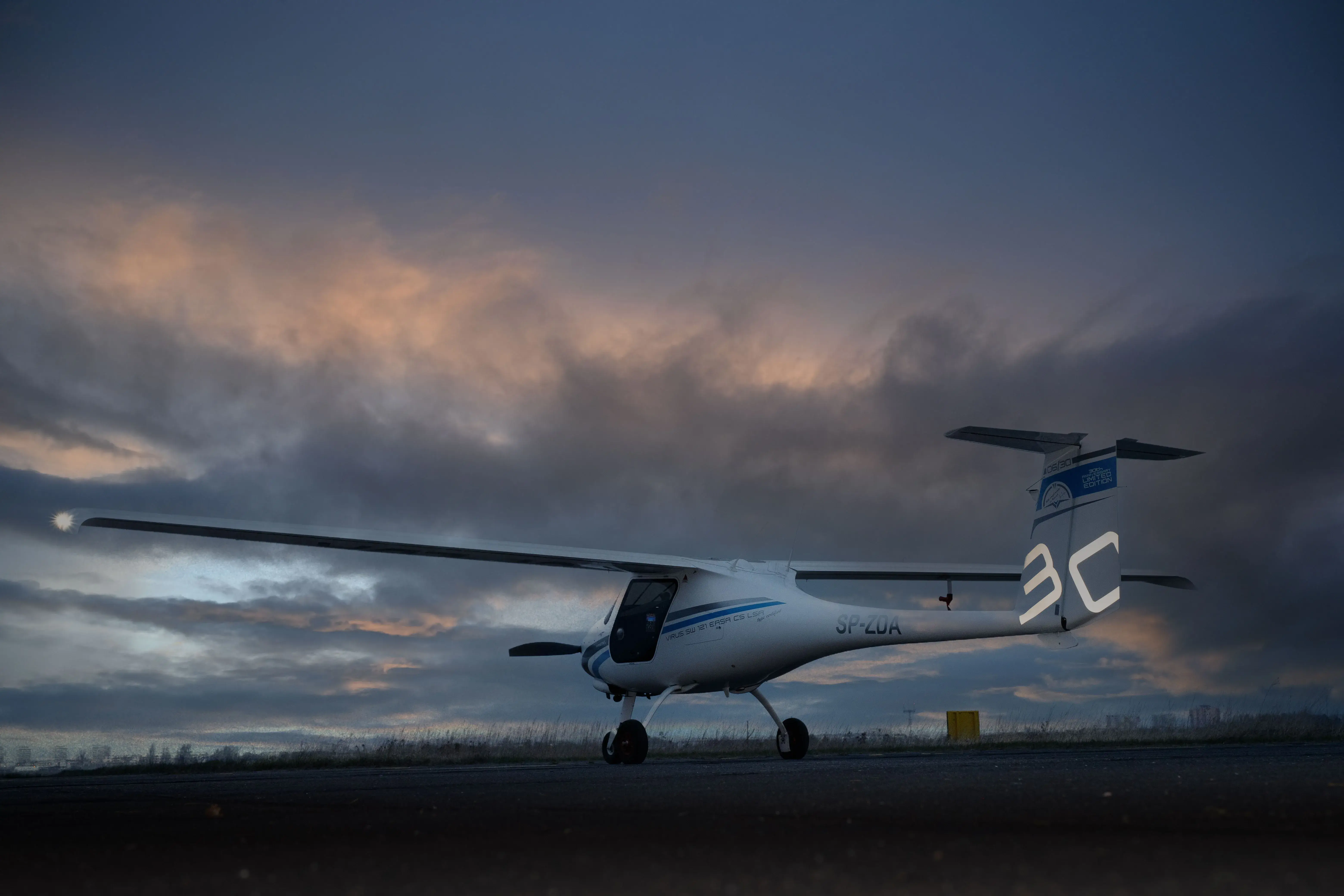 Light aircraft on the runway at dusk