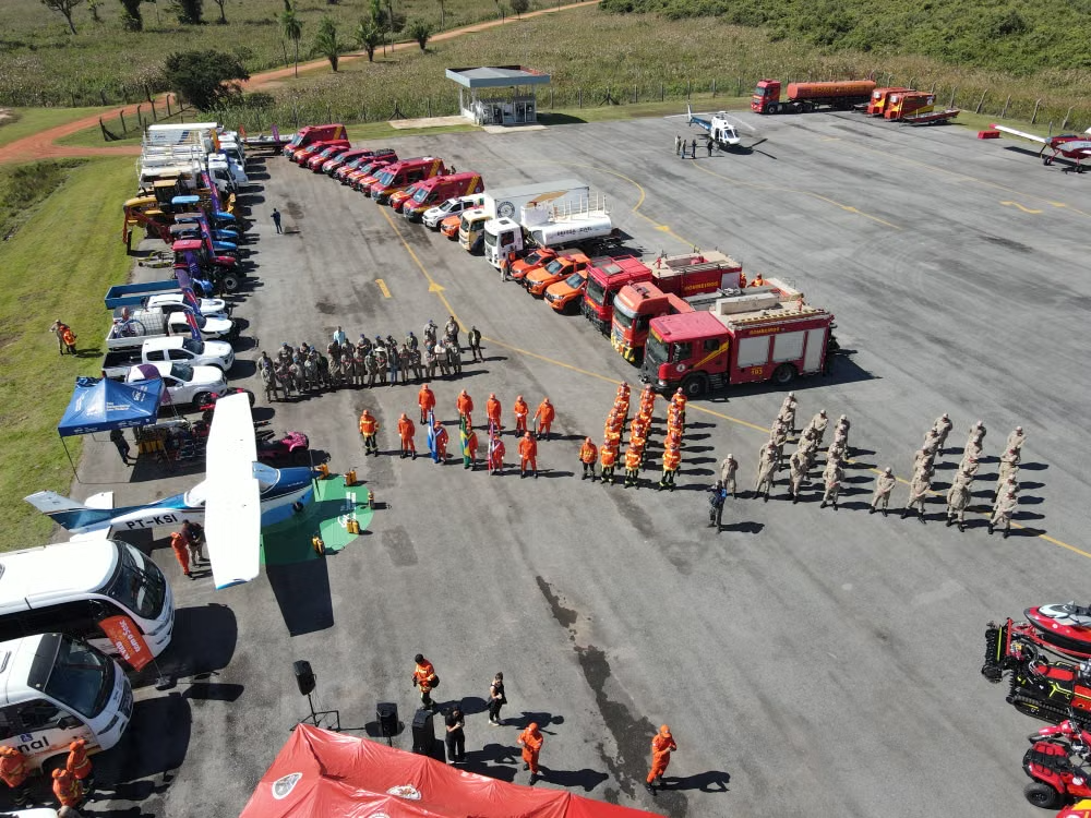 Aerial view of aircraft, response vehicles and personnel on an apron